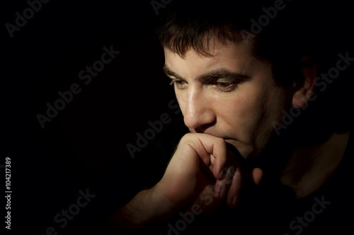 portrait of a pensive man on a dark background