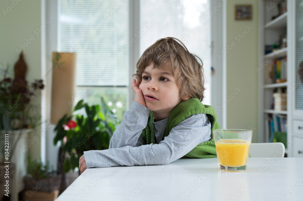 Little boy drinking range juice Little boy drinking range juice