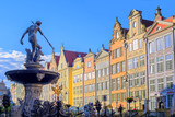 Neptune statue with colorful houses in background, Gdansk, Polan