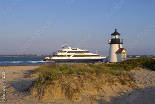 Ferry Passes By Lighthouse on Nantucket Island