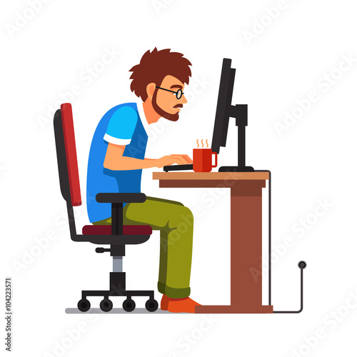 Work addict geek sitting at the computer desk