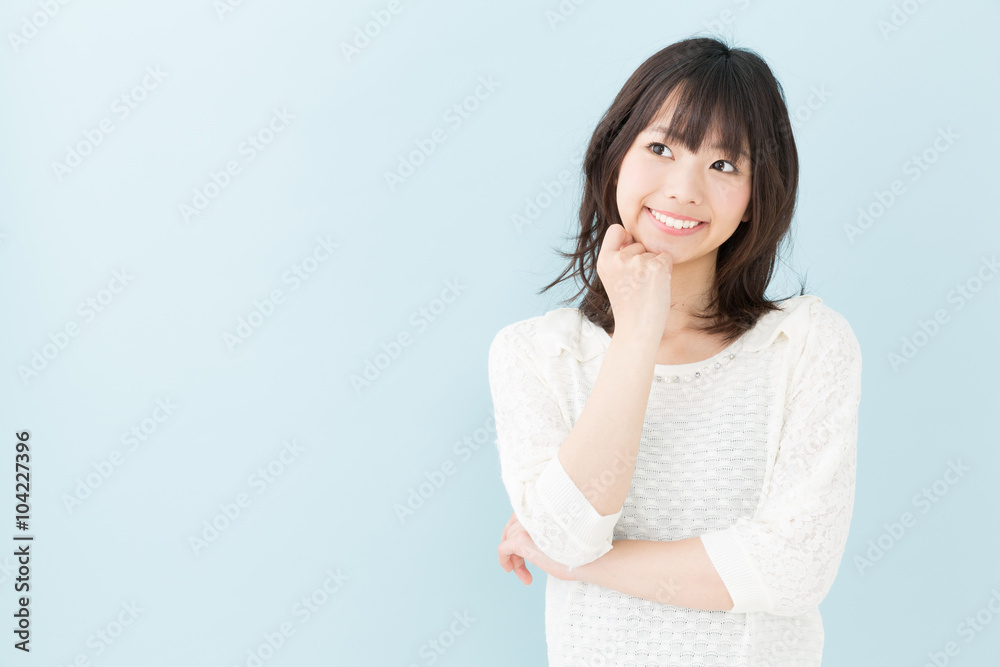 attractive asian woman on blue background