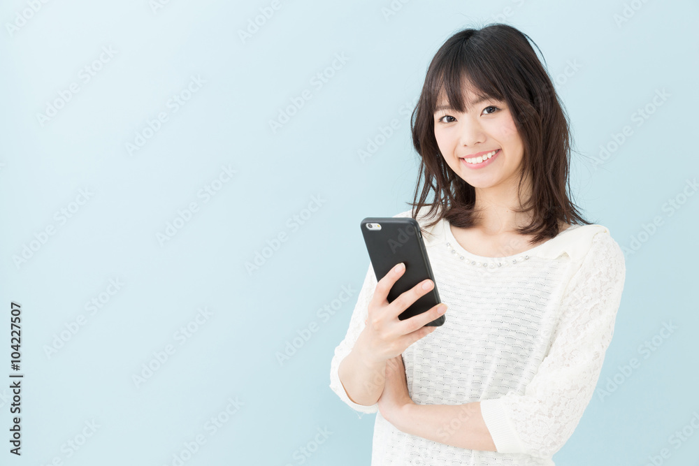 attractive asian woman on blue background attractive asian woman on blue background