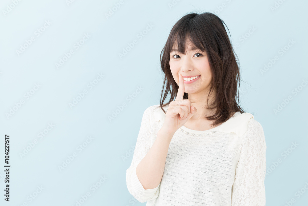attractive asian woman on blue background attractive asian woman on blue background