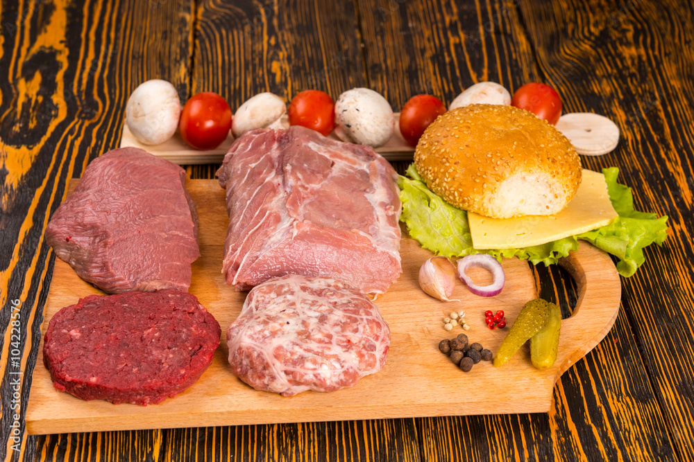 Cutting board with various meats for sandwiches