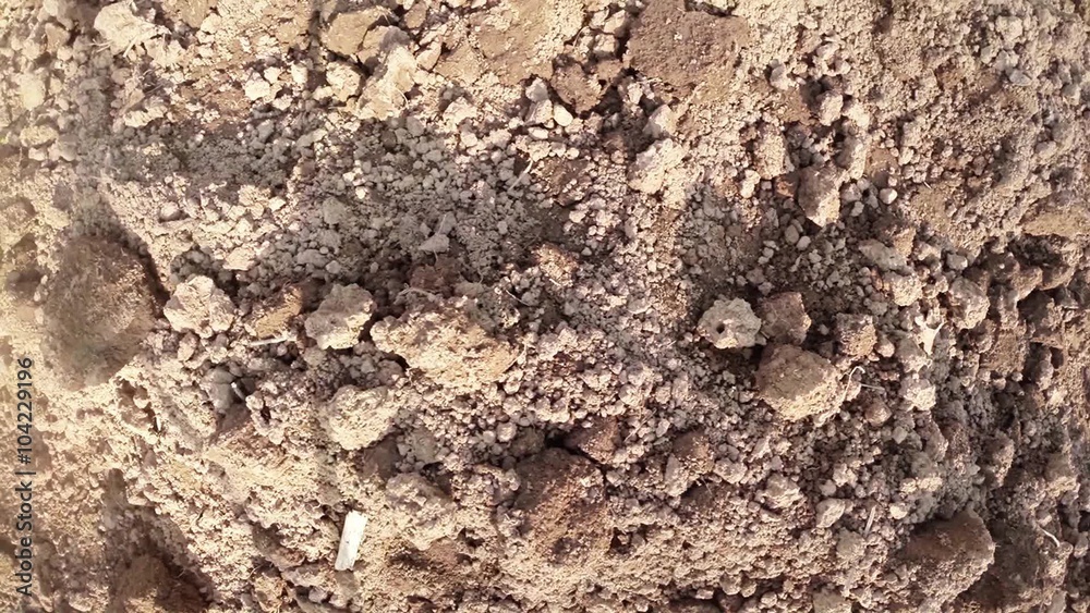 Small Pile of Sand Interspersed With Small Stones Small Pile of Sand Interspersed With Small Stones