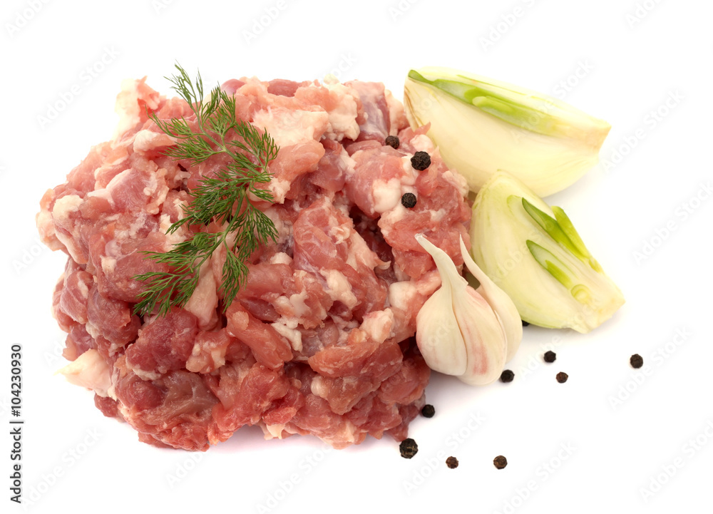 Minced meat, onion, garlic, pepper and herbs isolated on white background.
