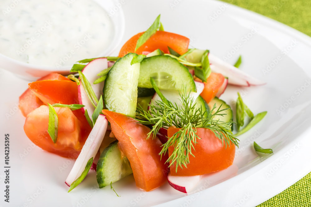 Fresh mixed vegetables salad on white plate
Fresh mixed vegetables salad on white plate