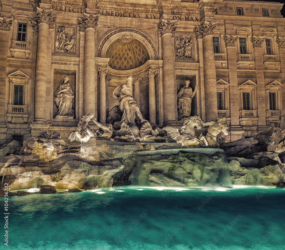 Night view of water and rocks in fountain