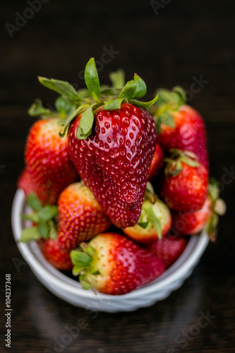 Half of strawberry isolated on black background