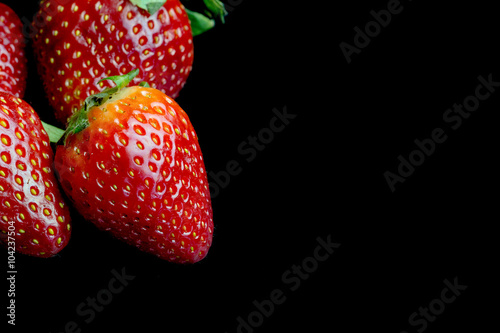 Wallpaper Mural Half of strawberry isolated on black background Torontodigital.ca