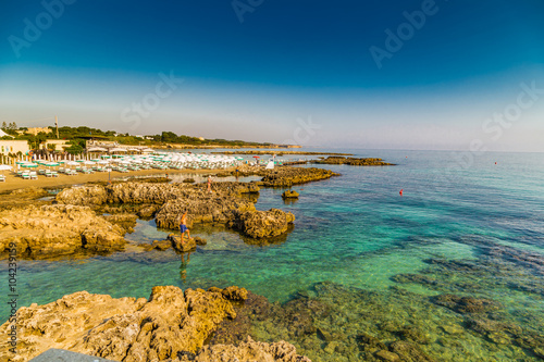 rocks in clear sea waters in Italy