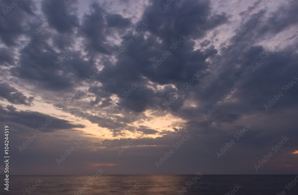 Beautiful sunrise with dramatic sky over Black sea, Crimea