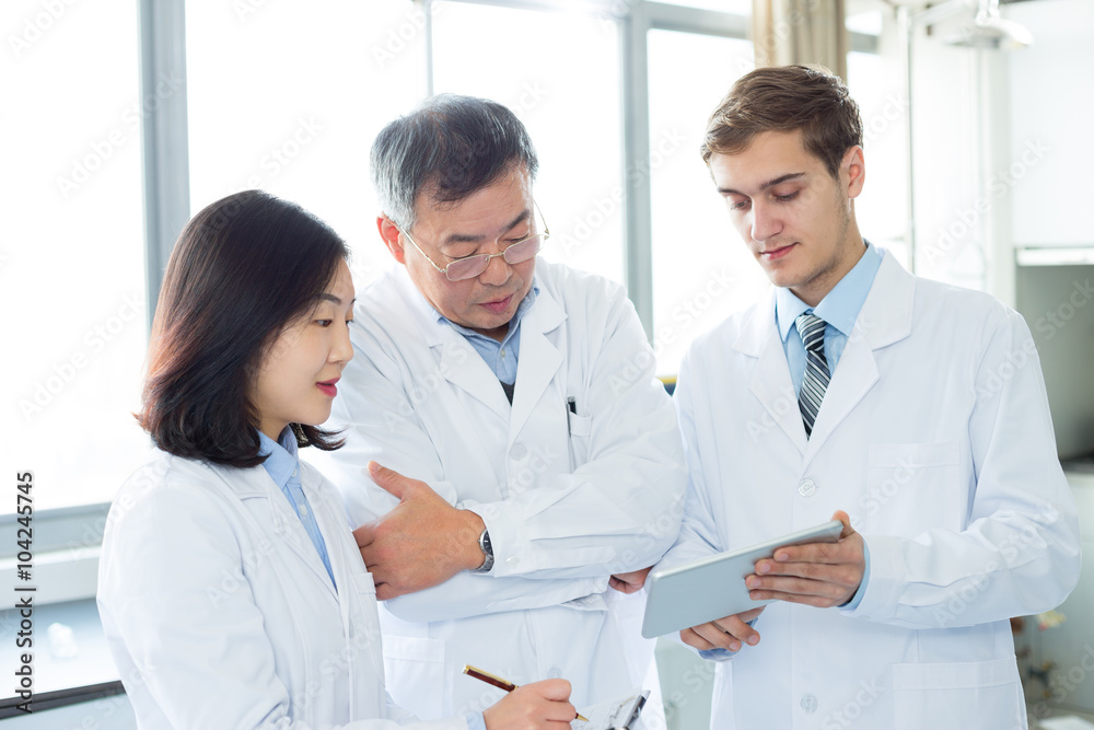 people doing chemical experiment in modern lab people doing chemical experiment in modern lab