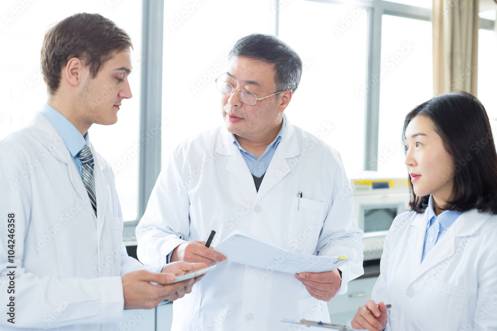 people doing chemical experiment in modern lab people doing chemical experiment in modern lab