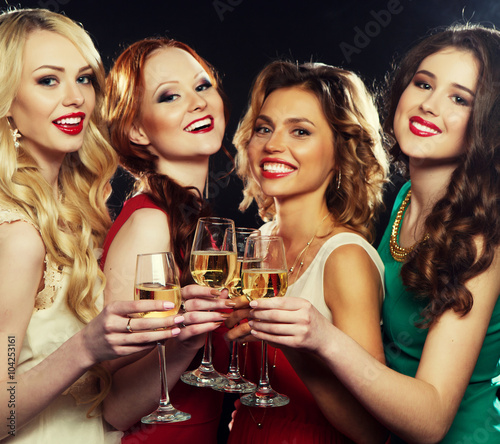 party girls clinking flutes with sparkling wine