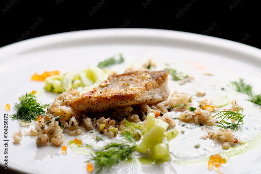 Fine dine, white fish fillet on wholegrain wild rice Fine dine, white fish fillet on wholegrain wild rice
