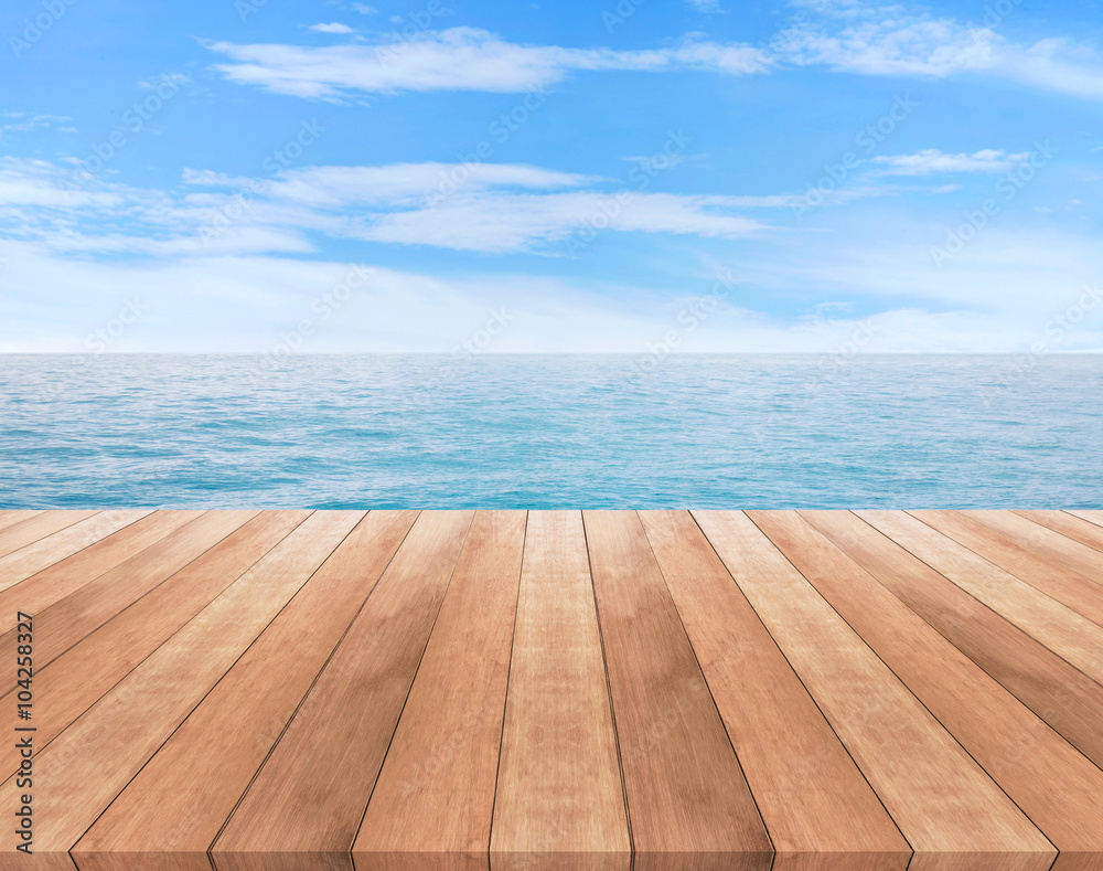 Wood table top on blue sea and sky background