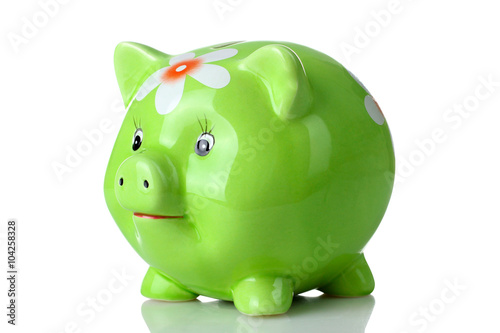 cute green piggy Bank with painted flower on a white isolated background
