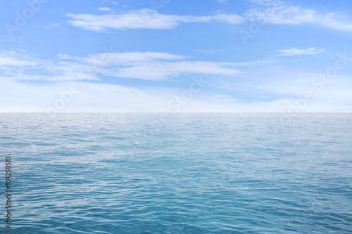 Summer seascape with blue sea and sky background