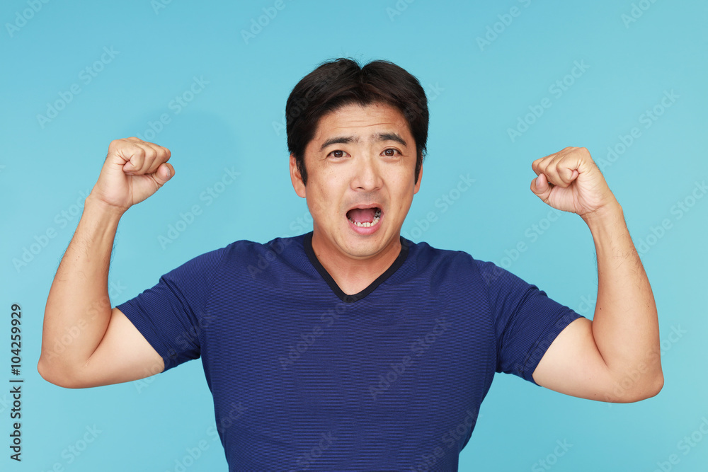 Fototapeta premium ガッツポーズの男性