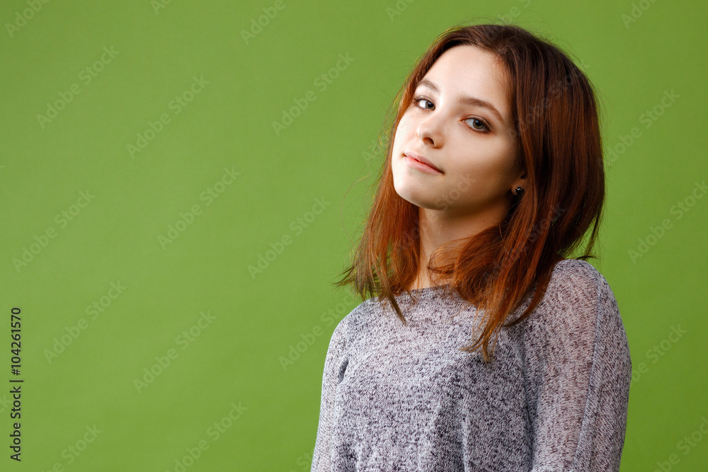 Fototapeta premium Teenage girl on green background