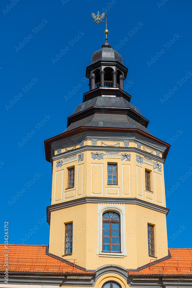 tower of the castle in Nesvizh on a background of blue sky