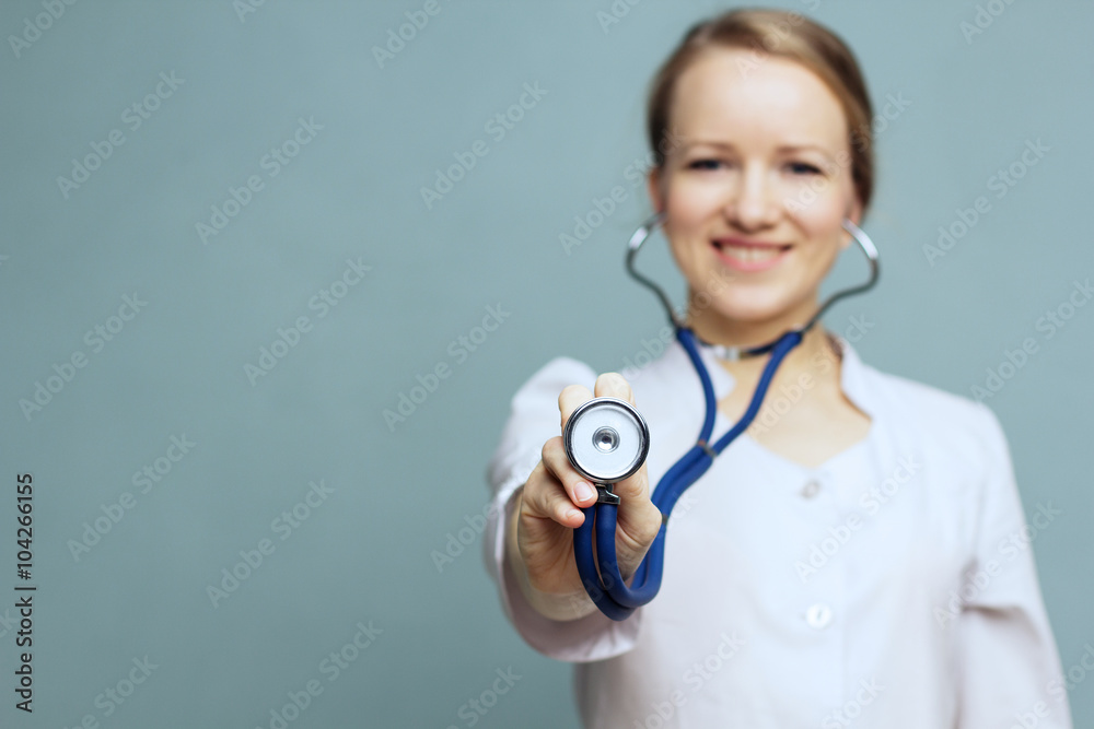 Concept: focus on the stethoscope. Doctor holding a stethoscope. Concept: focus on the stethoscope. Doctor holding a stethoscope.
