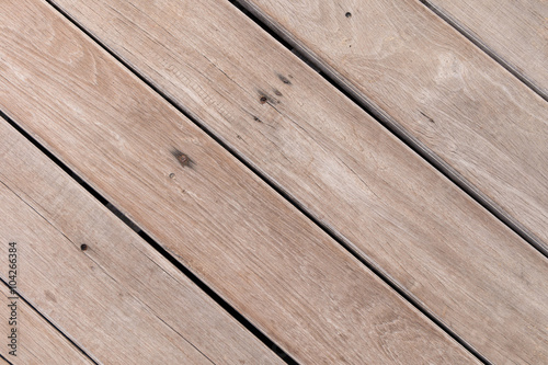 Diagonal wood plank near the beach. Top view