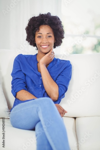 Portrait of smiling woman on the sofa