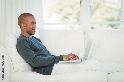 Handsome man using laptop