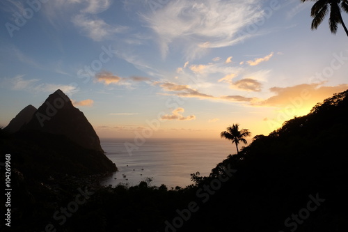 Pitons in a dramatic sunset in St Lucia with Soufriere beach in the background