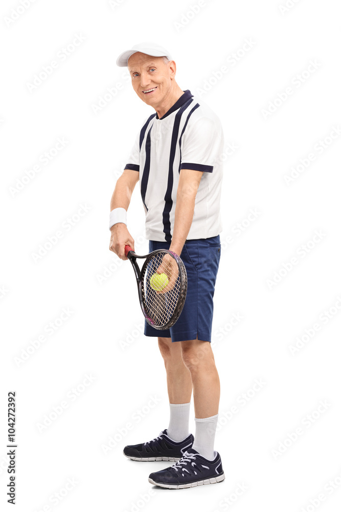 Senior man playing tennis