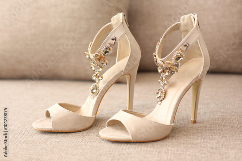 Bride's highheel shoes on sofa