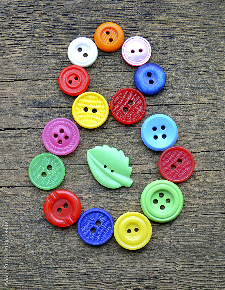 8 March International Women's Day symbol on old wooden background. Vintage background with sewing buttons to 8 march.