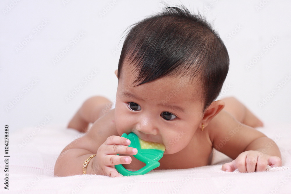 Cute Asian Baby Girl Biting Rubber Toy Cute Asian Baby Girl Biting Rubber Toy