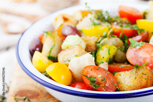 Traditional healthy Panzanella salad with fresh tomatoes and crispy bread