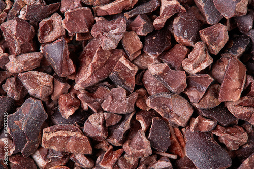 Cacao nibs background, close up