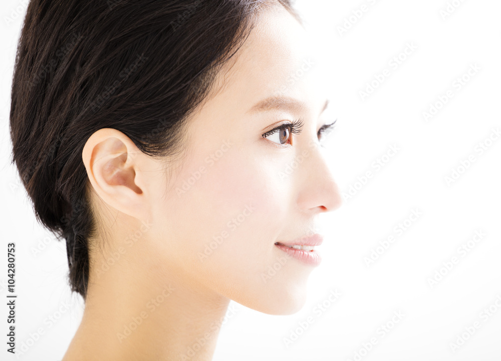 closeup beautiful young woman face closeup beautiful young woman face