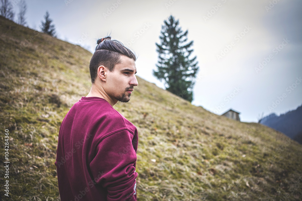 Young Man With Samurai Haircut in the Mountains Young Man With Samurai Haircut in the Mountains
