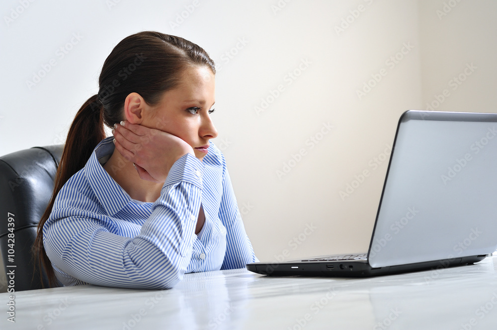Bored woman at work. Stock Photo | Adobe Stock