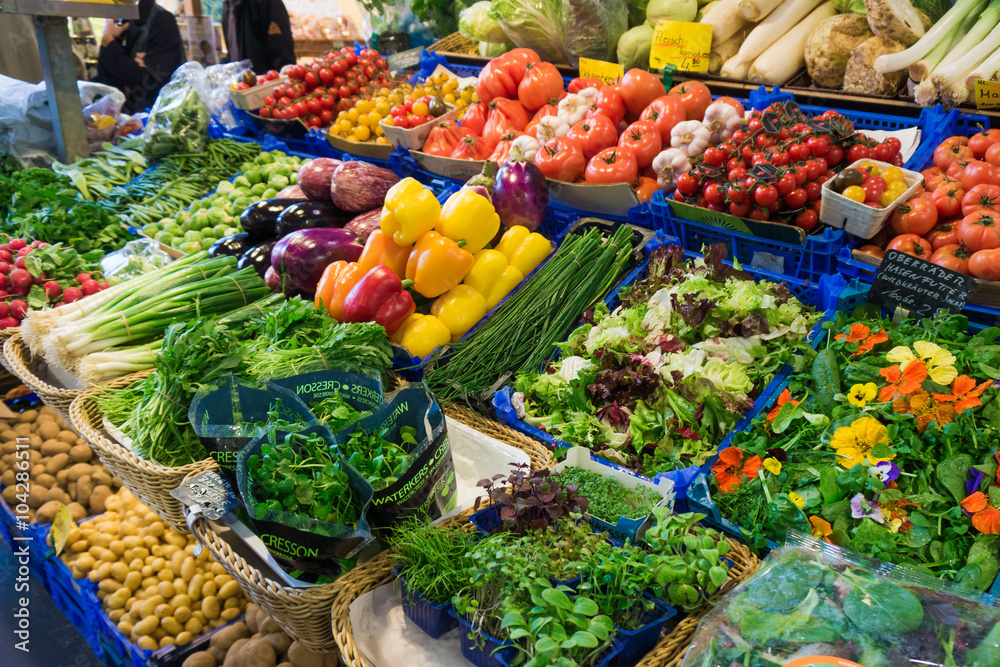 Fruits and vegetables at a farmers market.  Market stall with va
