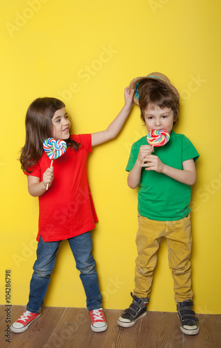Children enjoying lollipop