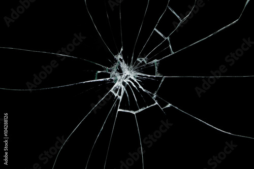 Broken glass on black background photo