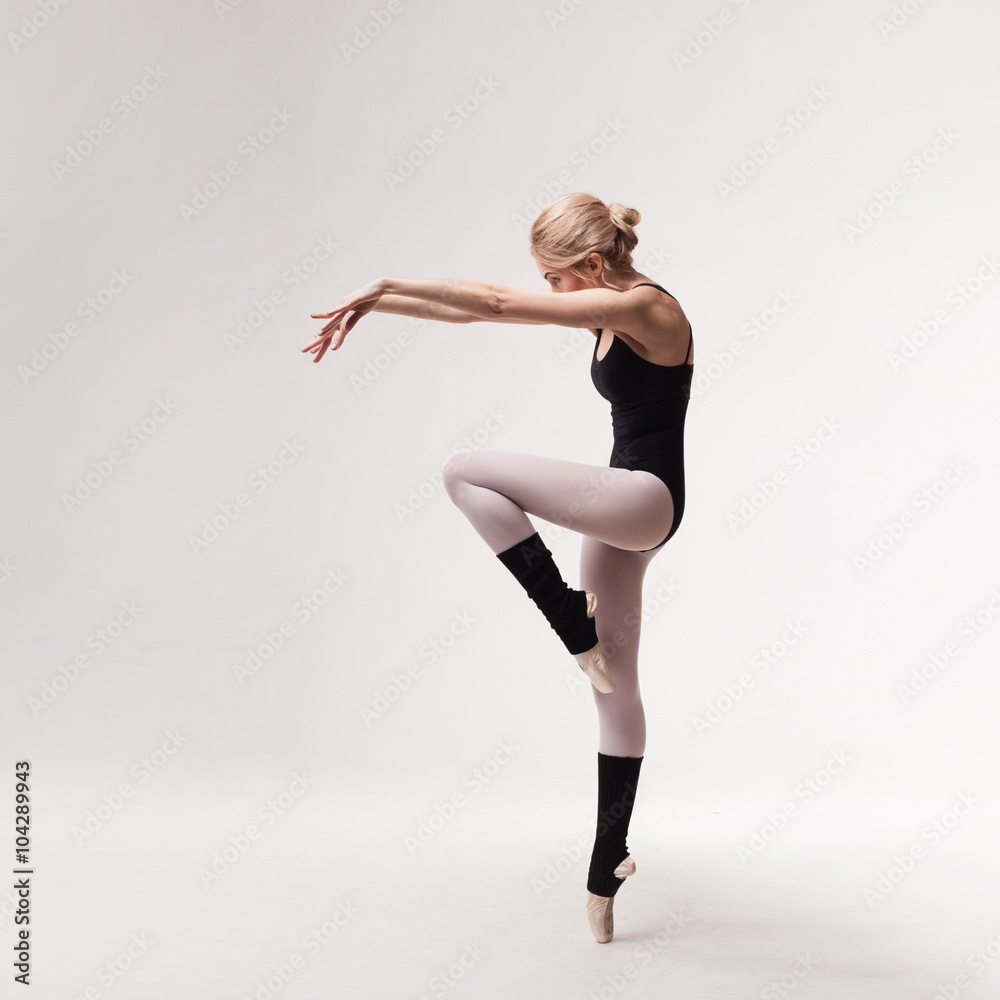 Ballerina in black outfit posing on toes Ballerina in black outfit posing on toes