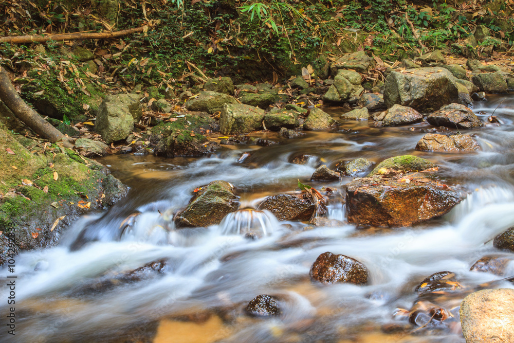 waterfall and rocks covered with moss waterfall and rocks covered with moss