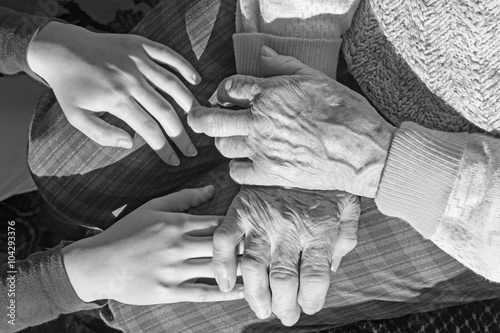 The hands of grandmother and grandchild © Renáta Sedmáková