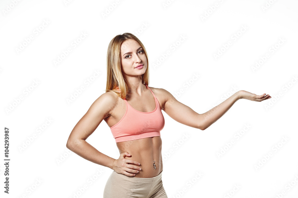 Beautiful young girl with a sports body with his hand raised up, on a white studio background space for your logo Beautiful young girl with a sports body with his hand raised up, on a white studio background space for your logo