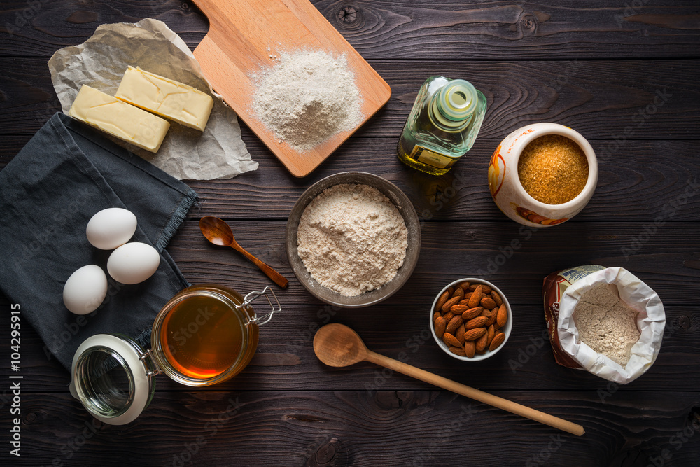 Ingredients for baking on a wooden background top view Ingredients for baking on a wooden background top view