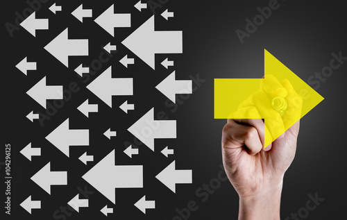Hand drawing arrow sign in opposite direction from others